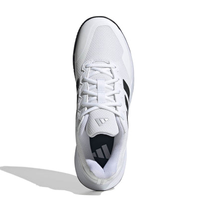 White tennis shoe with black accents on a white background