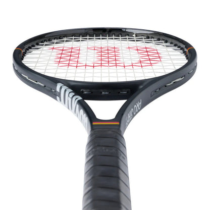Tennis racket with Wilson branding on a white background