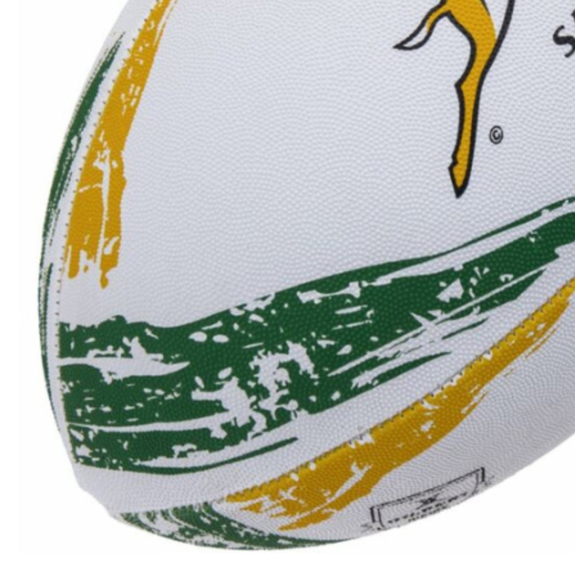 Close-up of a rugby ball with green and yellow design on a white background