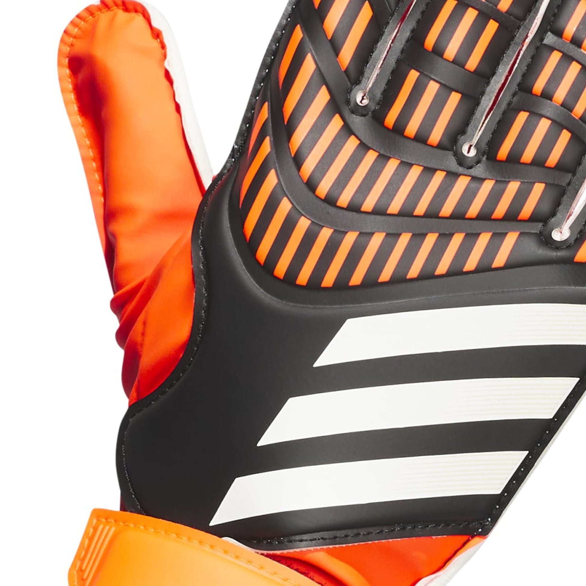 Close-up of an orange and black sports glove with a brand logo.