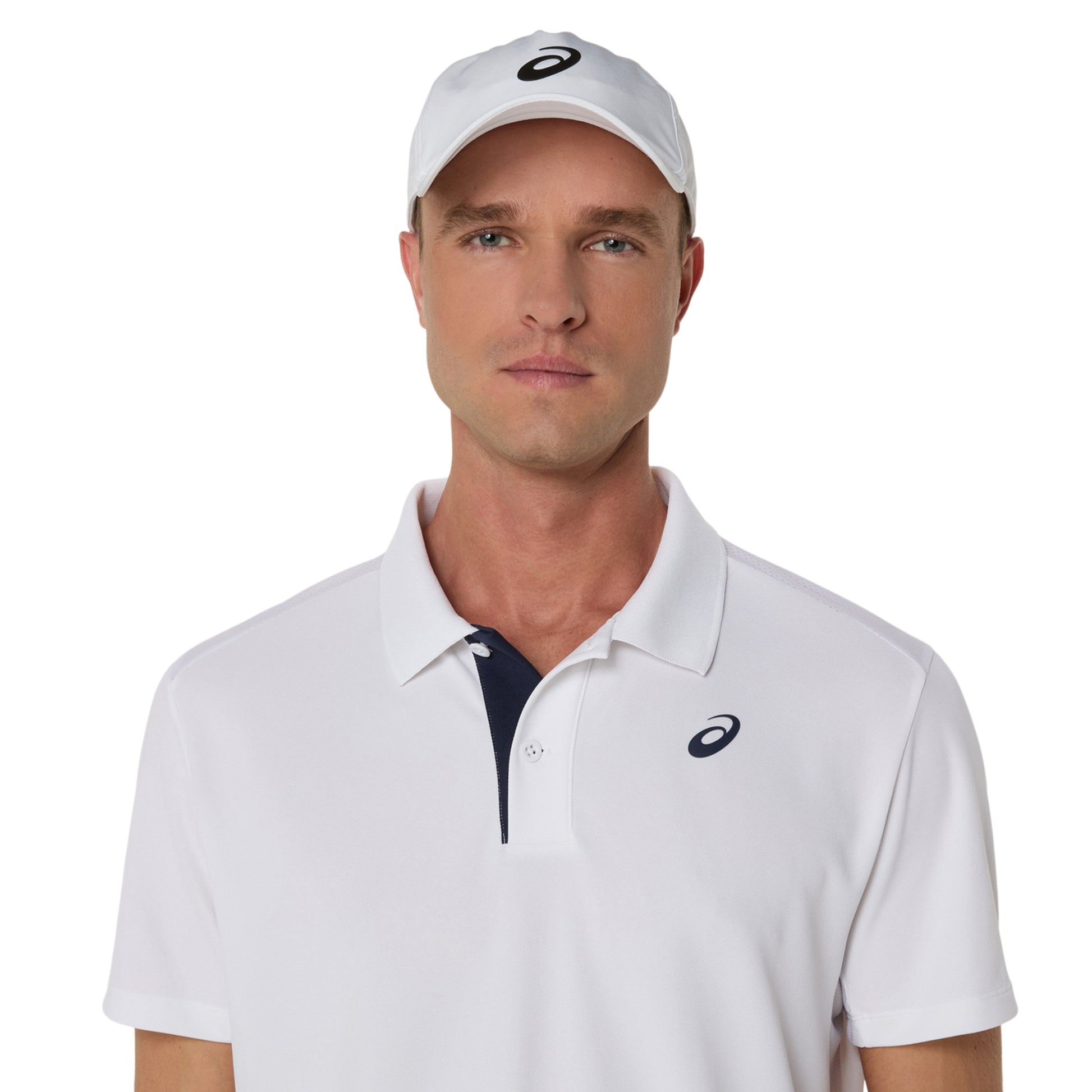 Man wearing a white Asics polo shirt and cap with a logo on a white background
