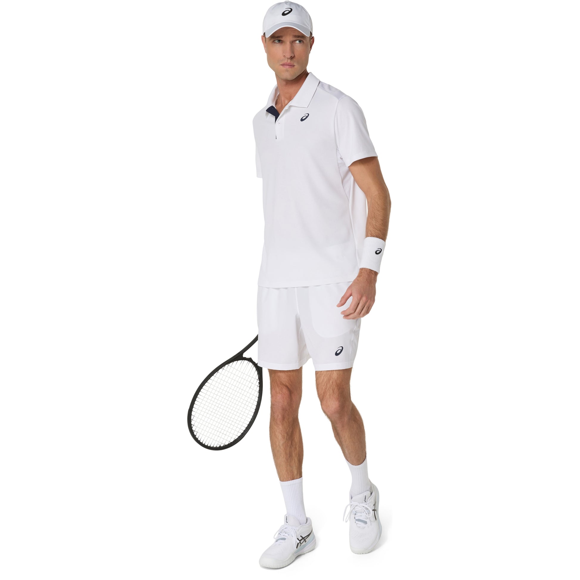 Man in white tennis outfit holding a racket on a white background