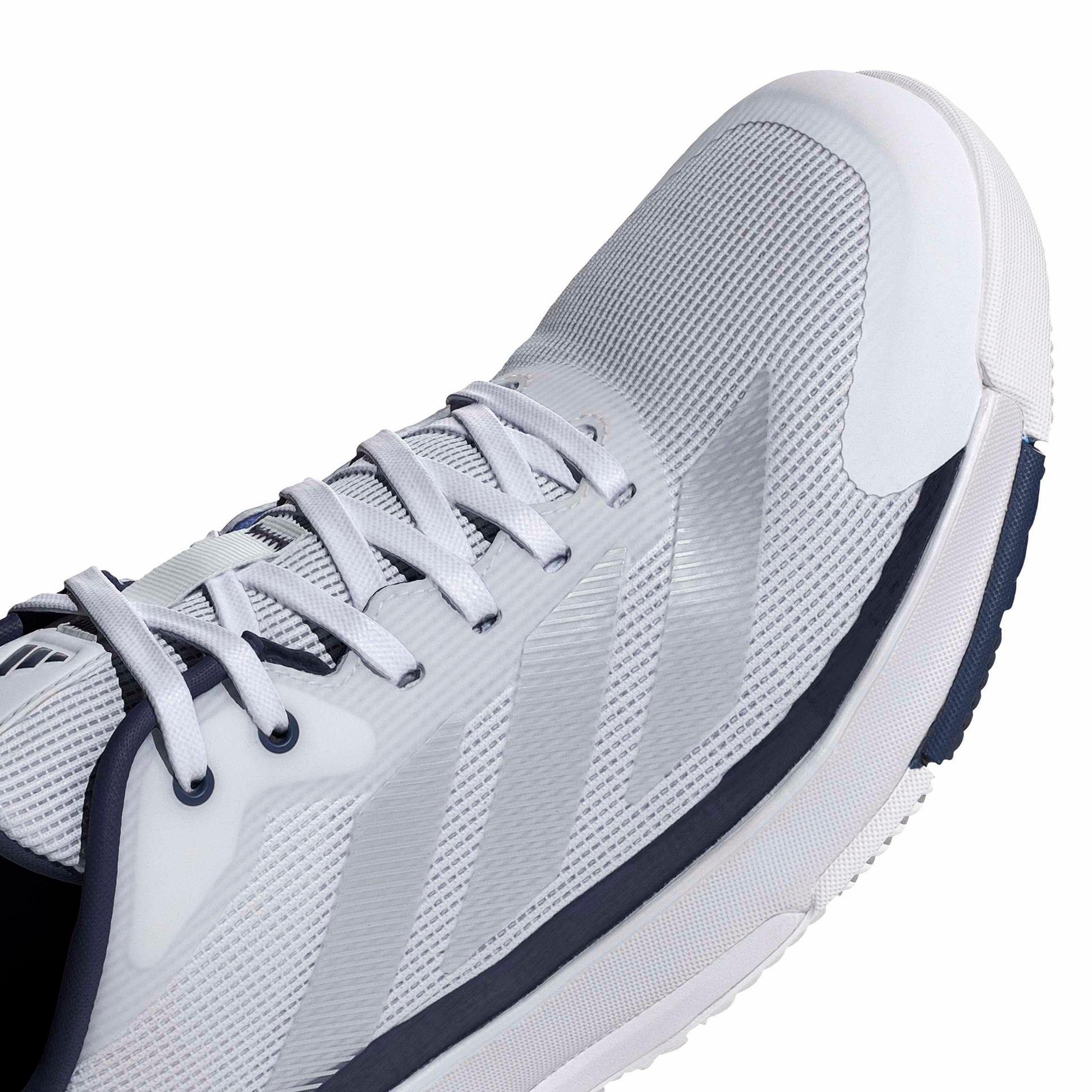 Close-up of a adidas shoe with white lases and blue accents on a white background
