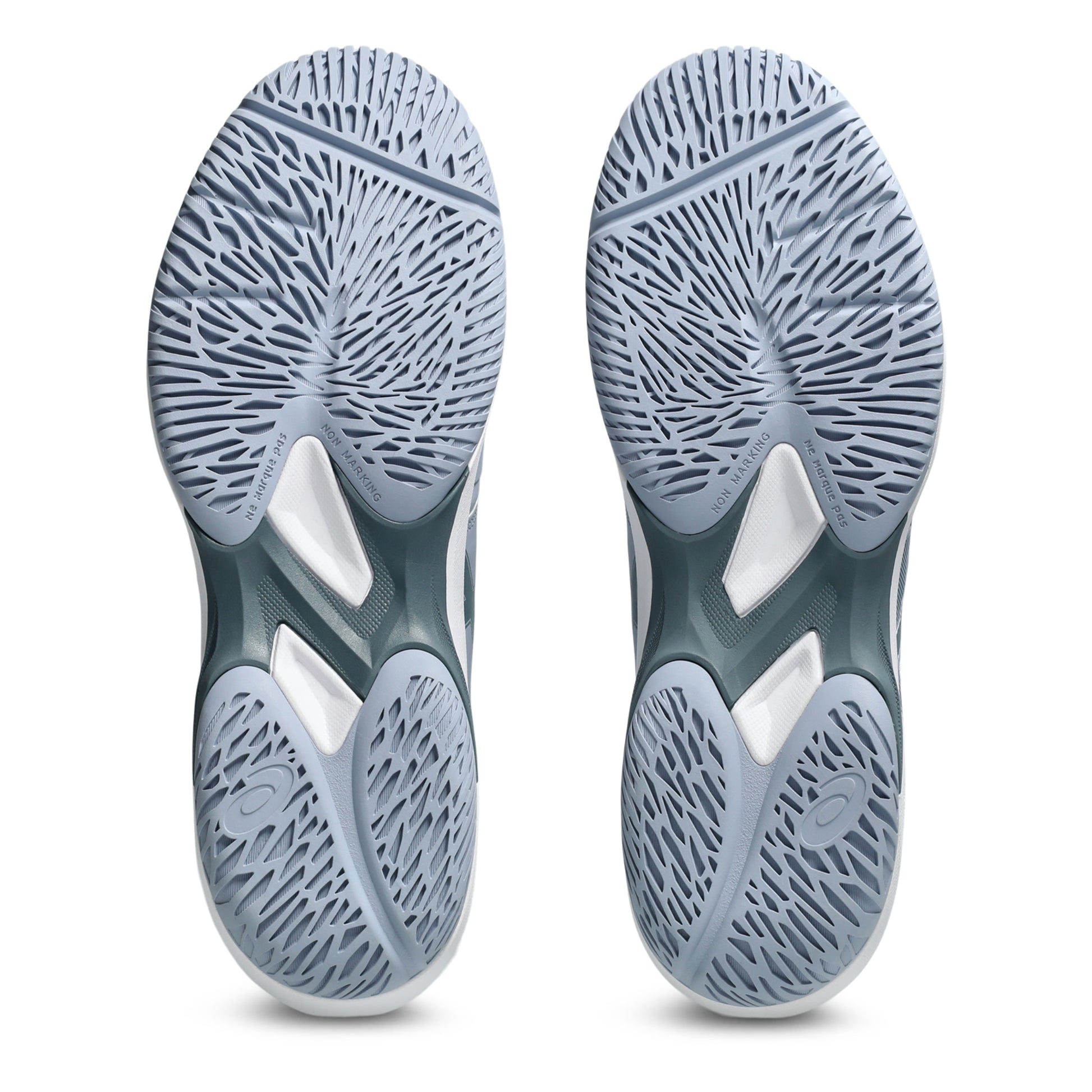 Close-up of a pair of gray tennis shoes with tread pattern on a white background