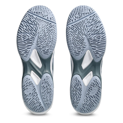 Close-up of a pair of gray tennis shoes with tread pattern on a white background