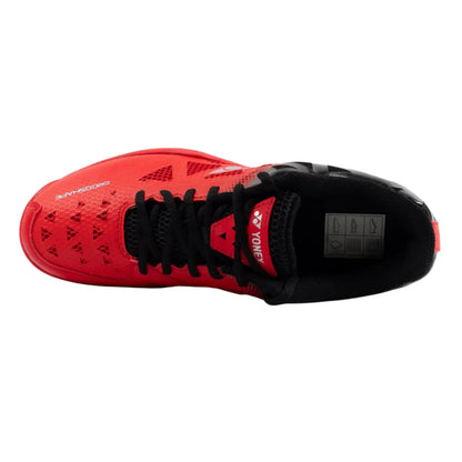 Red and black athletic shoe with Yonex branding on a white background