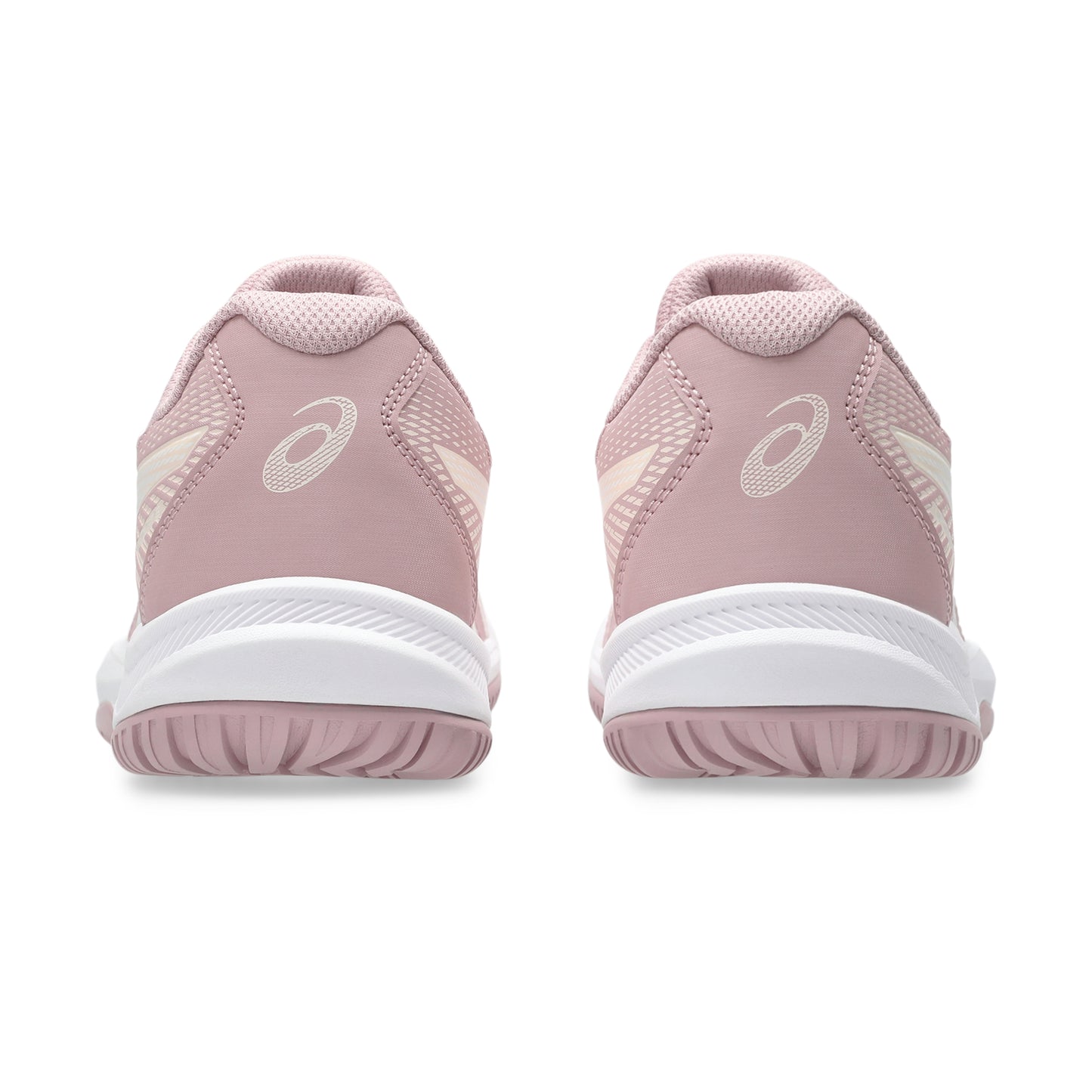 Pink athletic shoes with white soles on a white background