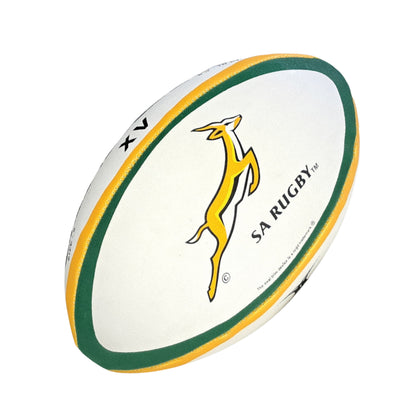White rugby ball with green and yellow trim featuring SA Rugby logo on a white background