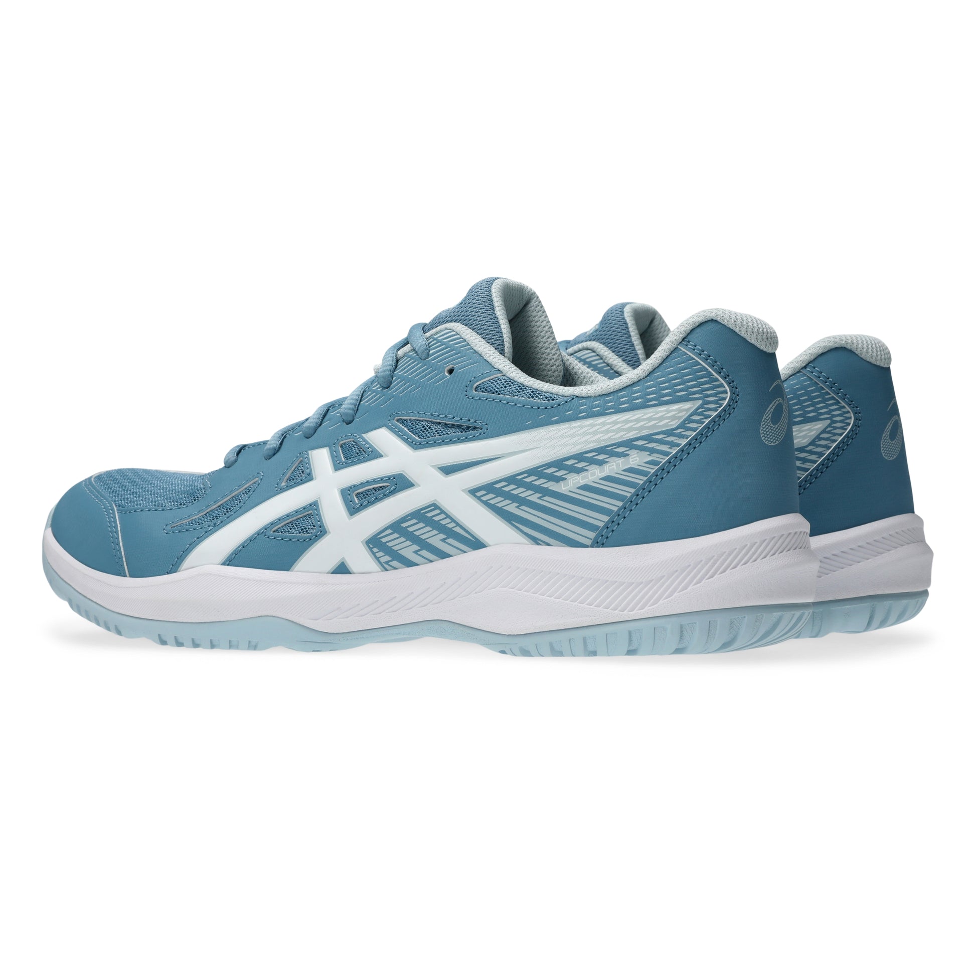 Pair of blue squash shoes with white accents on a white background