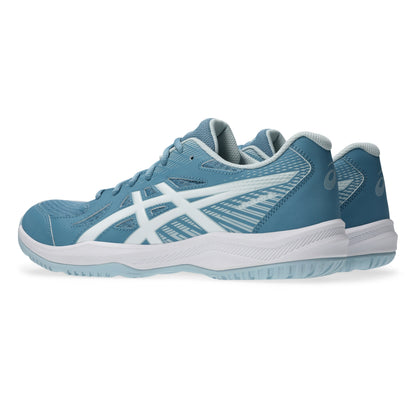 Pair of blue squash shoes with white accents on a white background