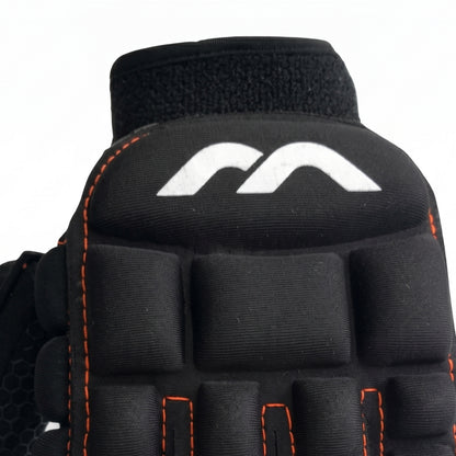 Black Mercian glove with orange stitching on a white background