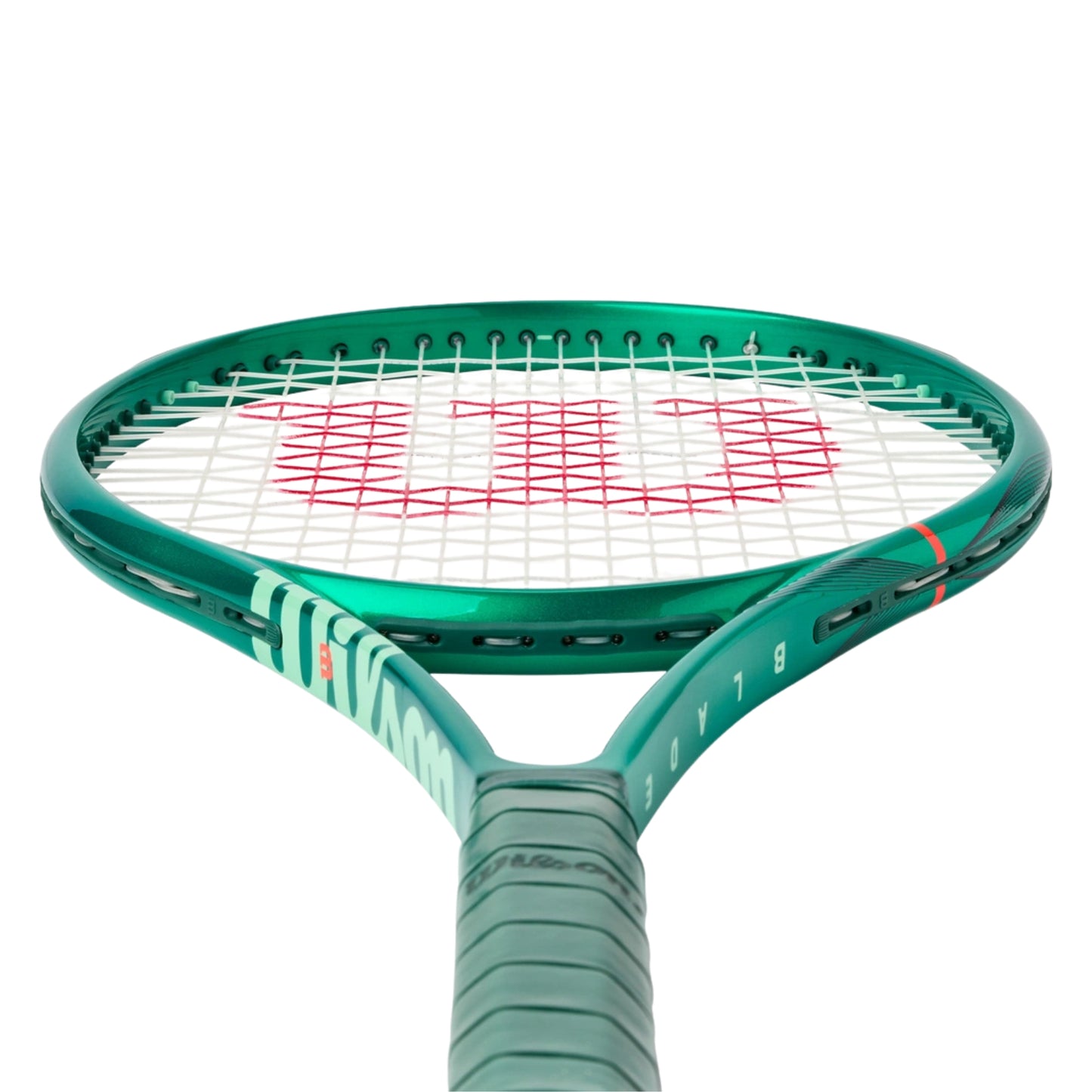 Tennis racket with green frame and white strings on a white background