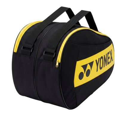 Black and yellow Yonex tennis racket bag on a white background