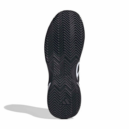 Black tennis shoe sole with logo on a white background