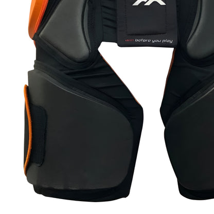 Black protective gear with orange accents on a white background