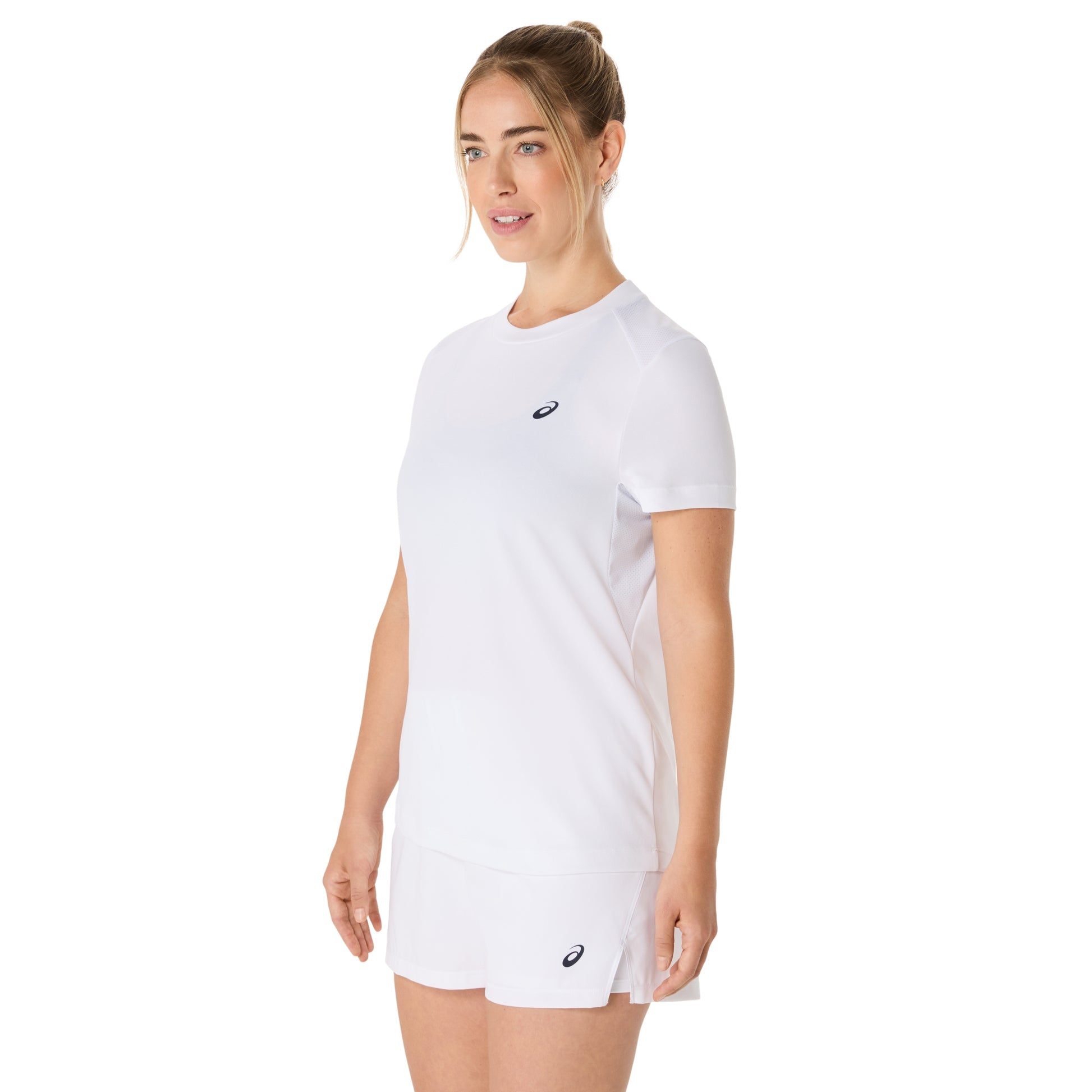 Woman wearing a white Asics t-shirt with a logo on a white background