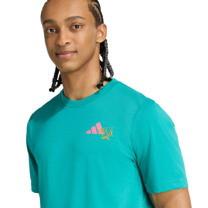 Person wearing a teal Adidas shirt with a logo on a white background
