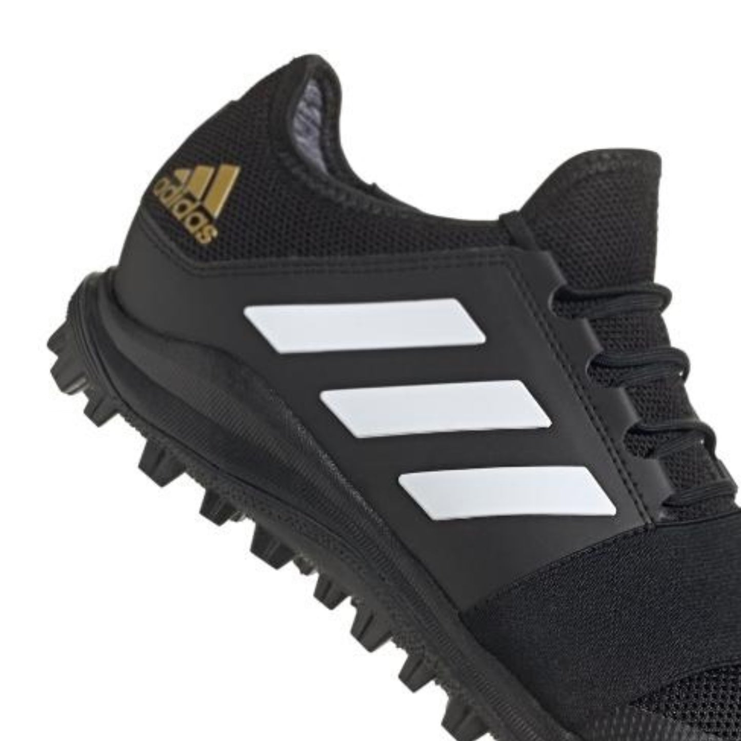Black Adidas hockey shoe with white stripes on a white background