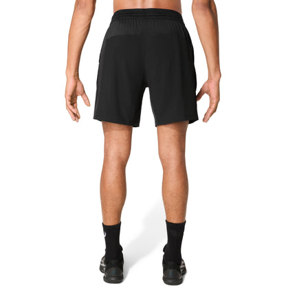 Man wearing black shorts on a white background