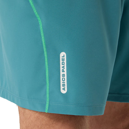 Teal shorts with a visible Asics Padel logo on a white background