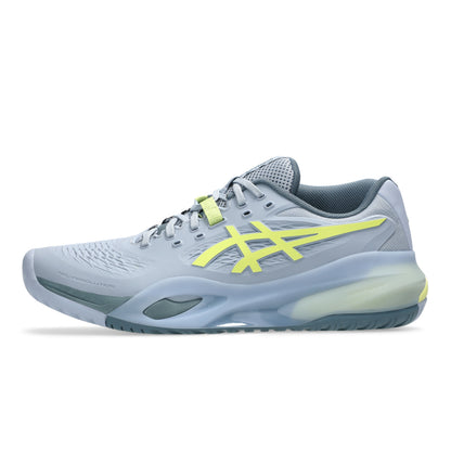 Gray and yellow tennis shoe on a white background