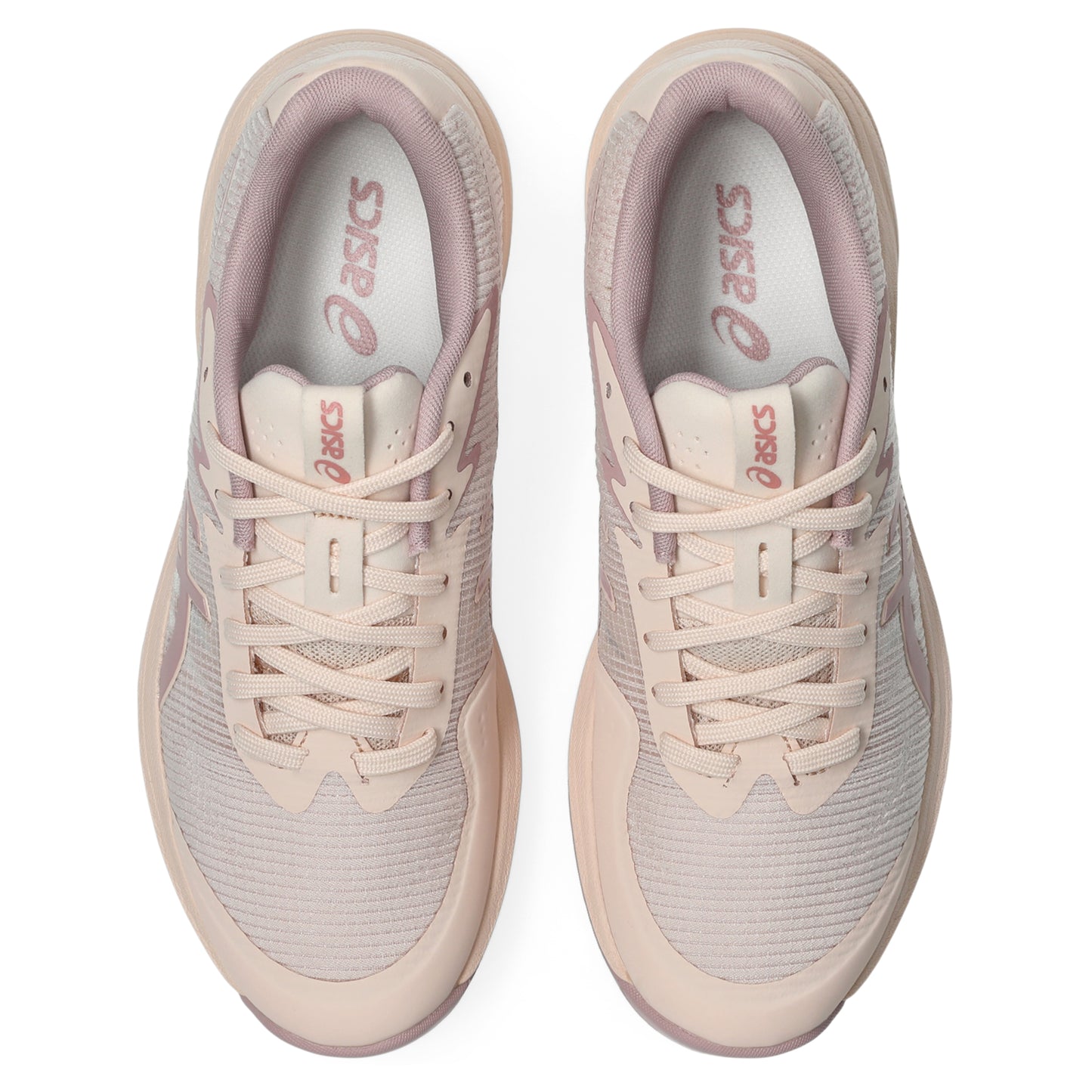 Pair of light pink Asics netball shoes on a white background