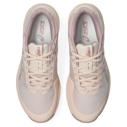 Pair of light pink Asics netball shoes on a white background
