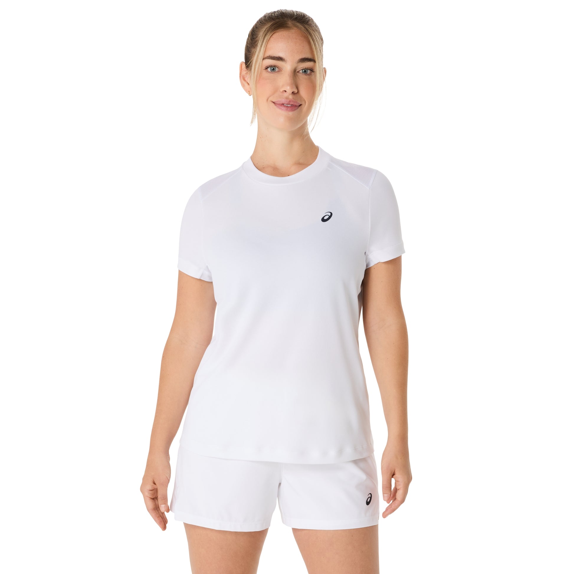 Woman wearing a white Asics t-shirt and shorts with a brand logo on a white background