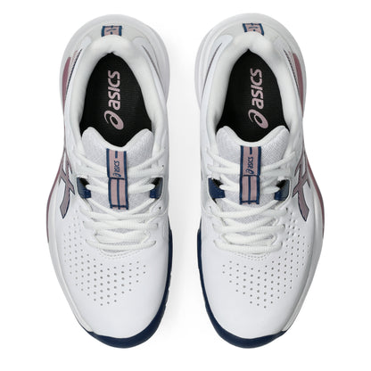 A pair of ASICS tennis shoes in white, featuring a dark navy blue outsole, a pink and navy heel accent, and a navy logo on the side, set against a plain white background.