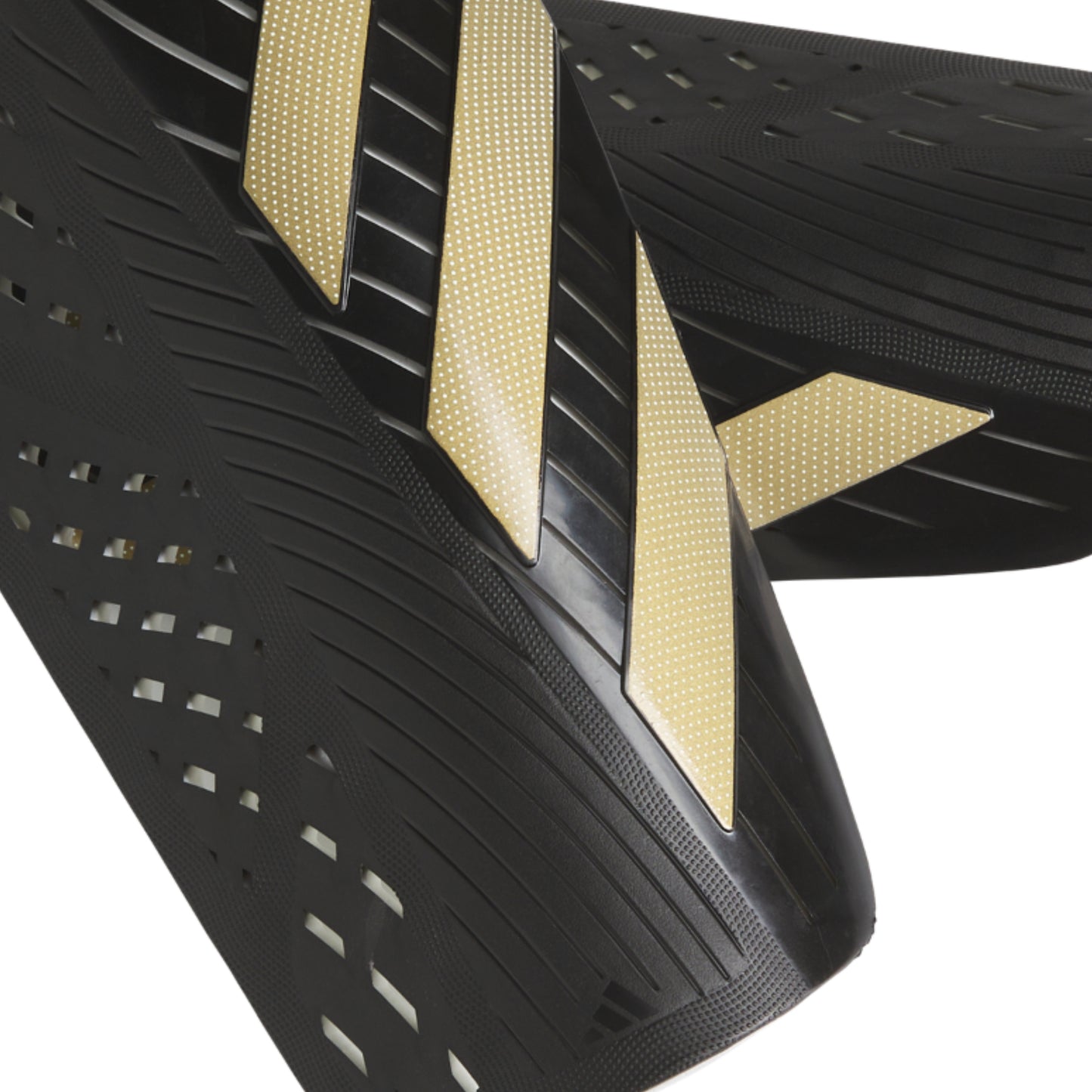 Black and gold athletic shoe sole with textured pattern