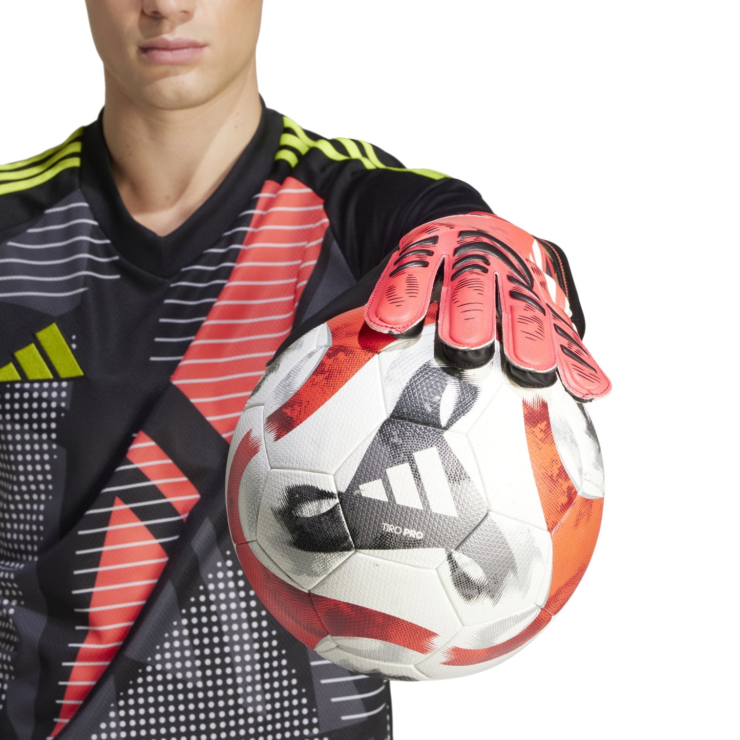 Soccer gloves Adidas holding a soccer ball 