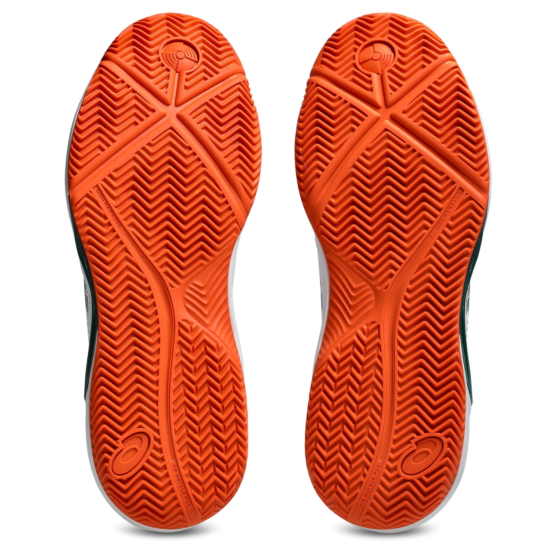 The outsoles of a pair of Asics padel shoes, featuring a vibrant orange textured tread pattern with black and white side accents visible on the edges.