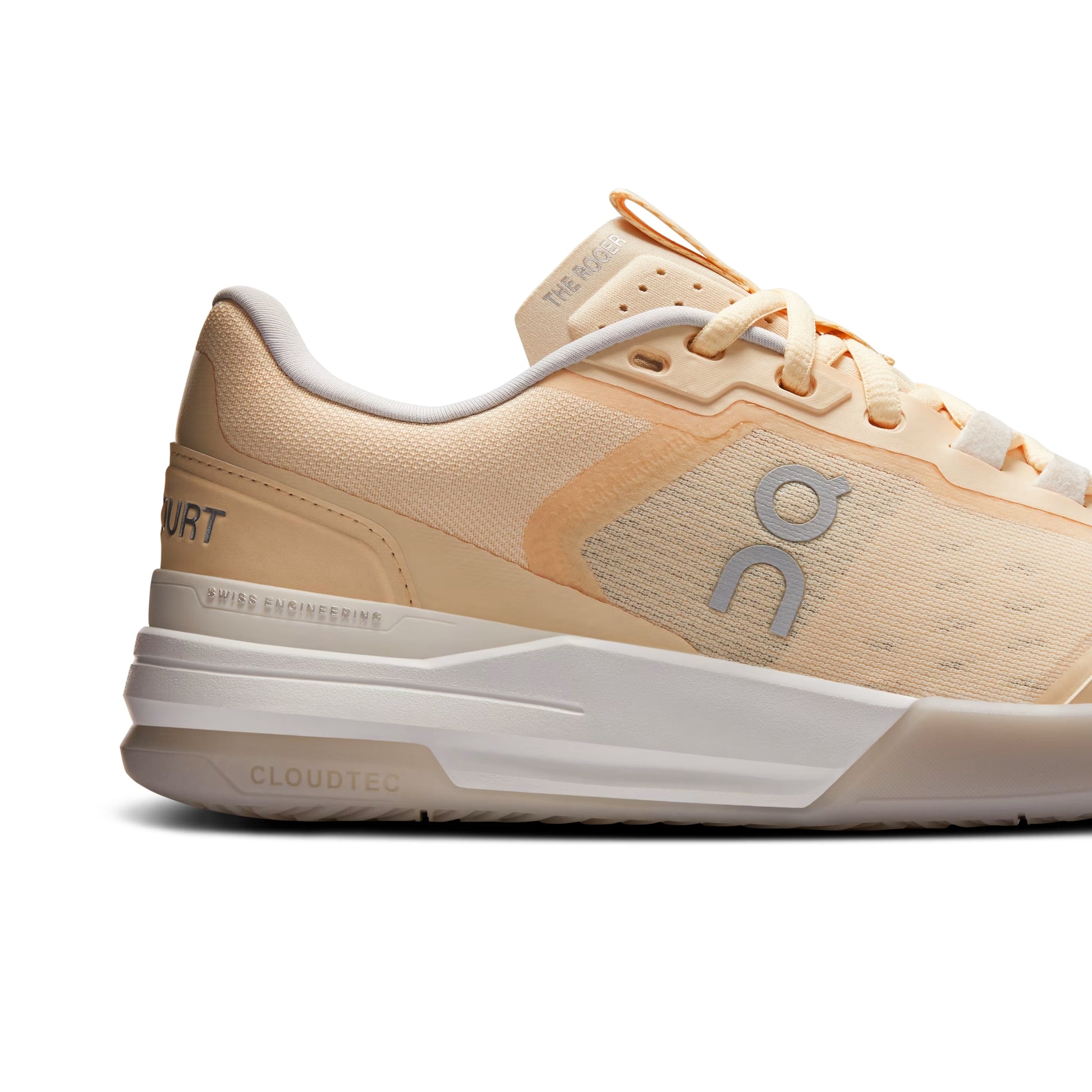 A side profile view of an On tennis shoe in a light peach and beige colorway, featuring a white CloudTec sole and a gray 'on' logo on the side panel.