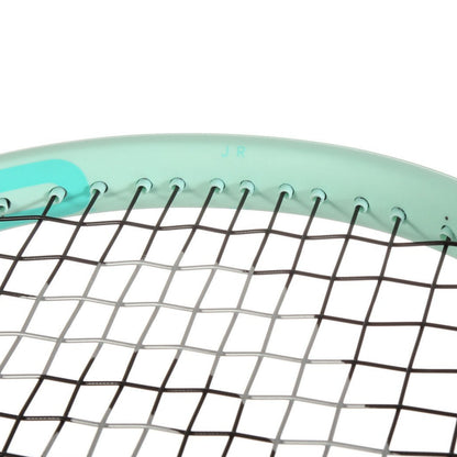Close-up of a tennis racket with a white and green frame on a white background