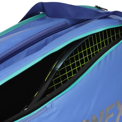 Blue tennis bag with green interior and visible brand name