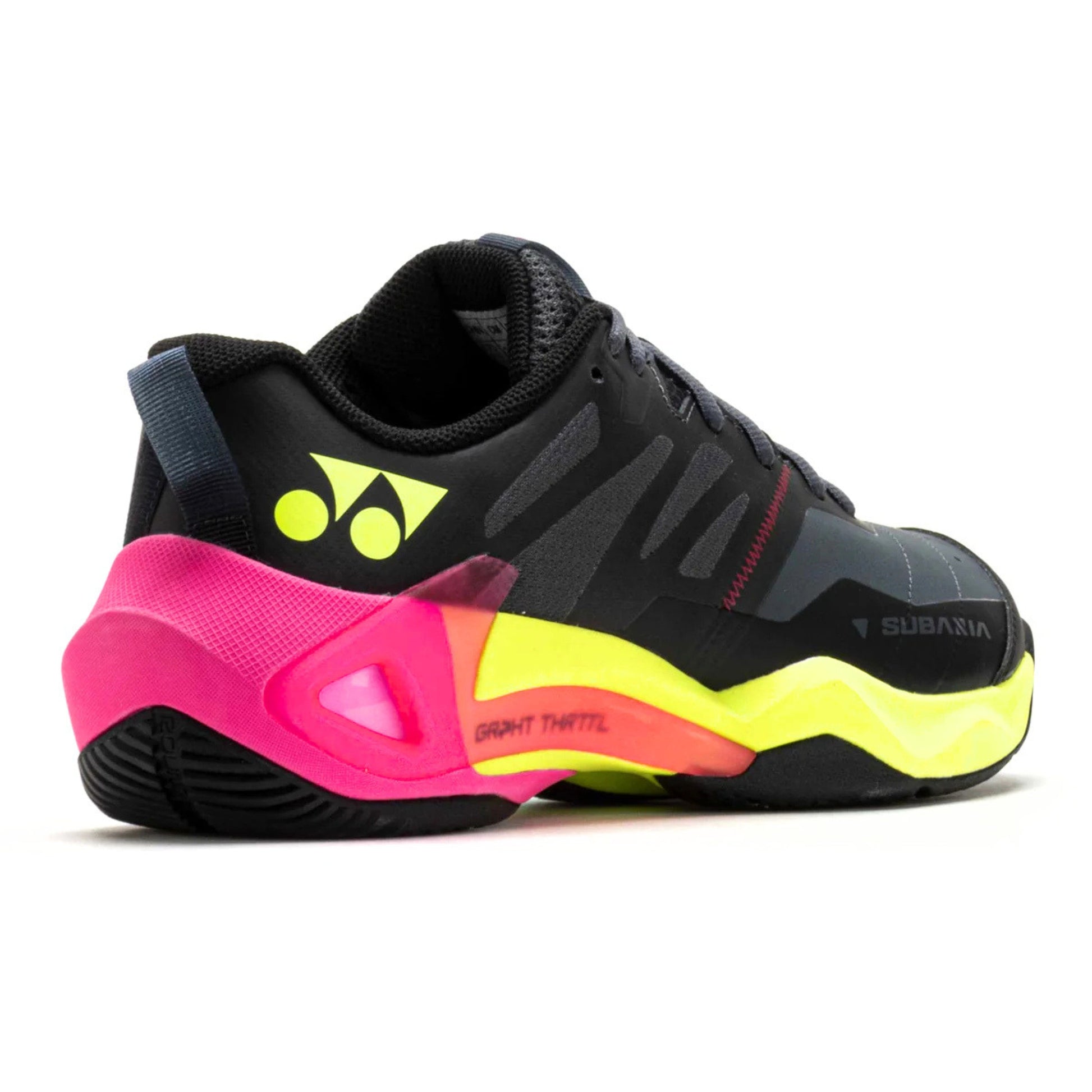 Black and neon yellow Yonex shoe with pink accents on a white background