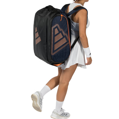 Person wearing a sports backpack with a visible brand logo on a white background