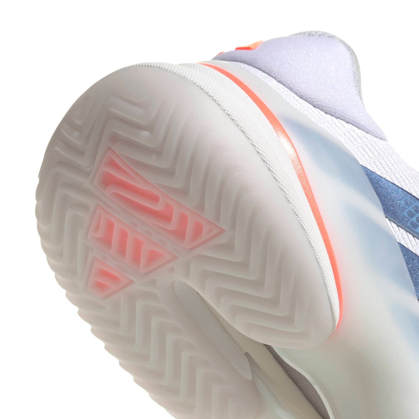 Close-up of a adidas tennis shoe with a focus on the sole and brand logo.