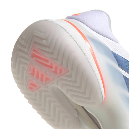 Close-up of a adidas tennis shoe with a focus on the sole and brand logo.