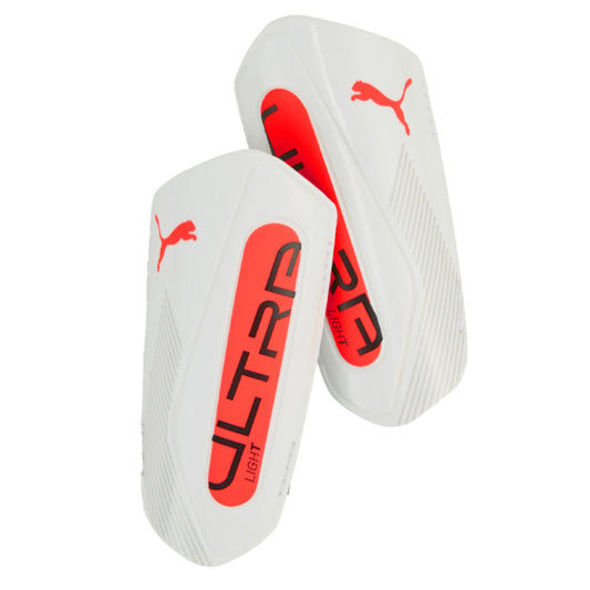 White shin guards with red and black text and Puma logo on a white background