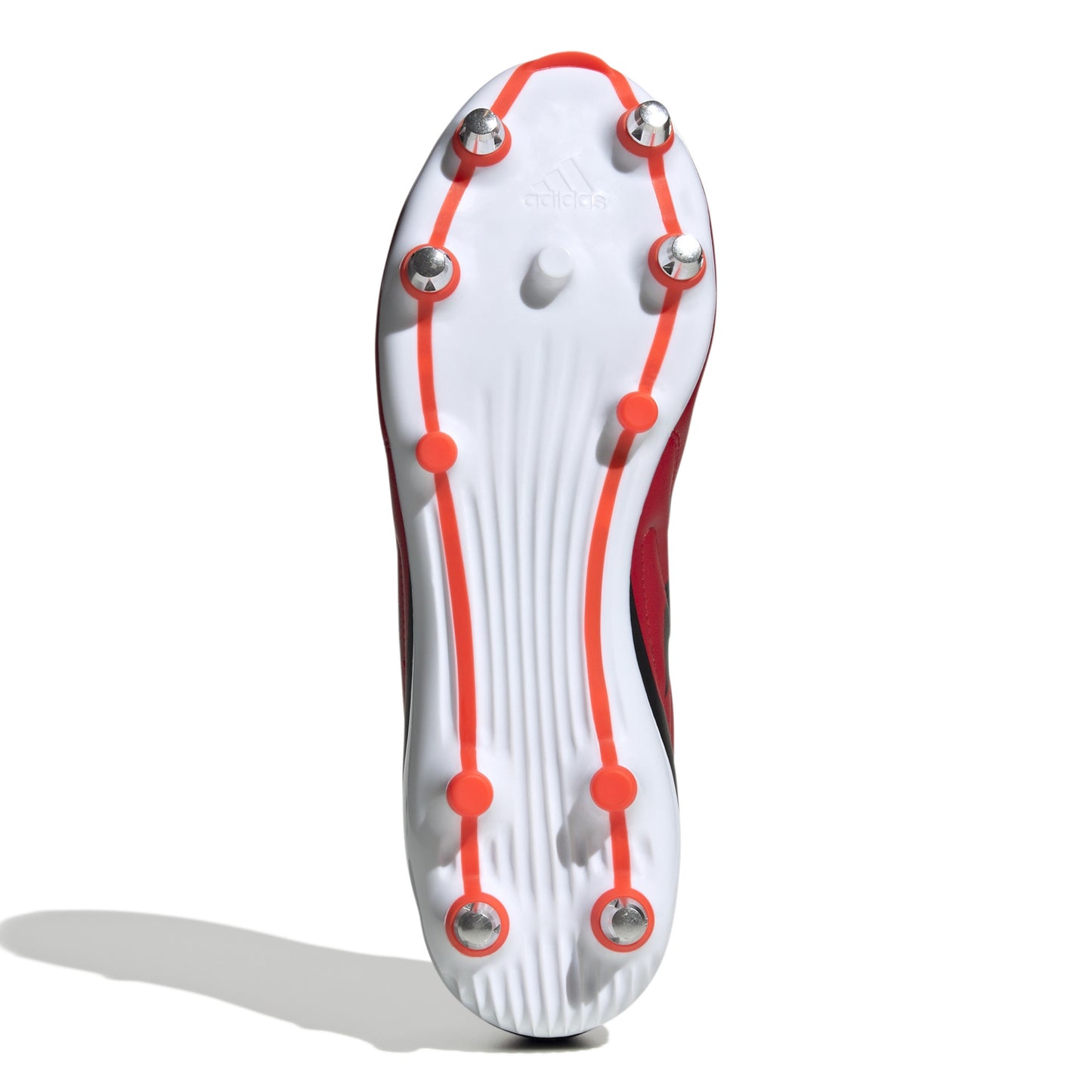 Bottom view of red and black rugby boot with white sole on a white background