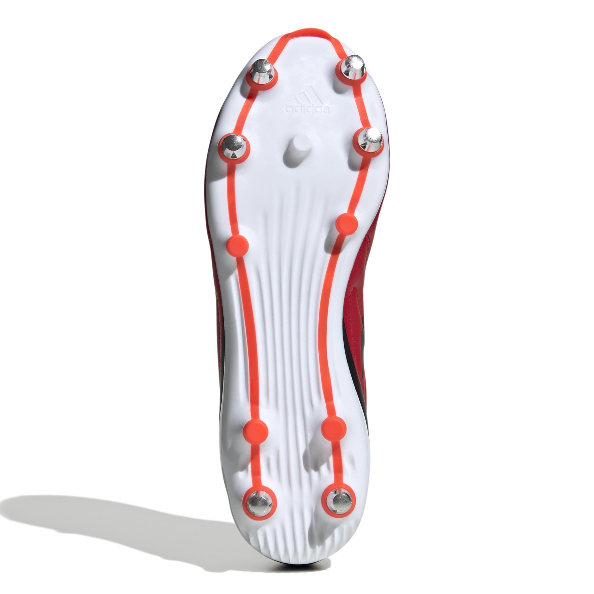 Bottom view of red and black rugby boot with white sole on a white background