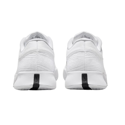 White tennis shoes with black accents on a white background
