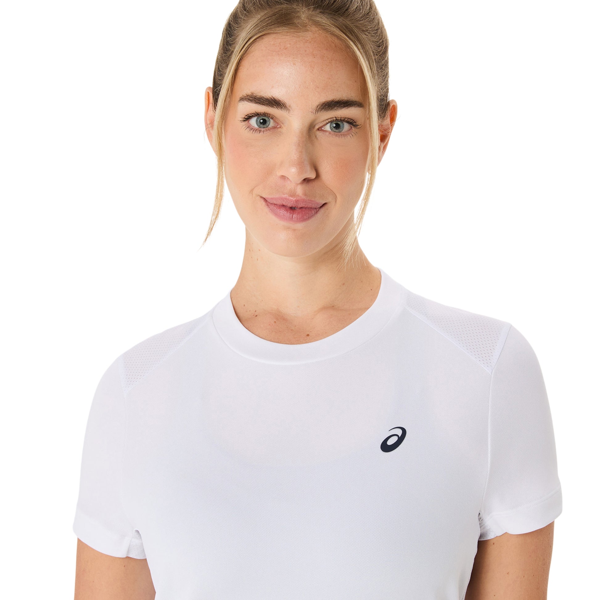Woman wearing a white Asics t-shirt with a logo on a white background