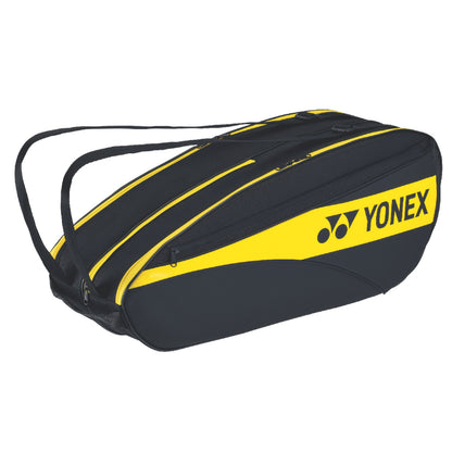 Black and yellow Yonex tennis racket bag on a white background