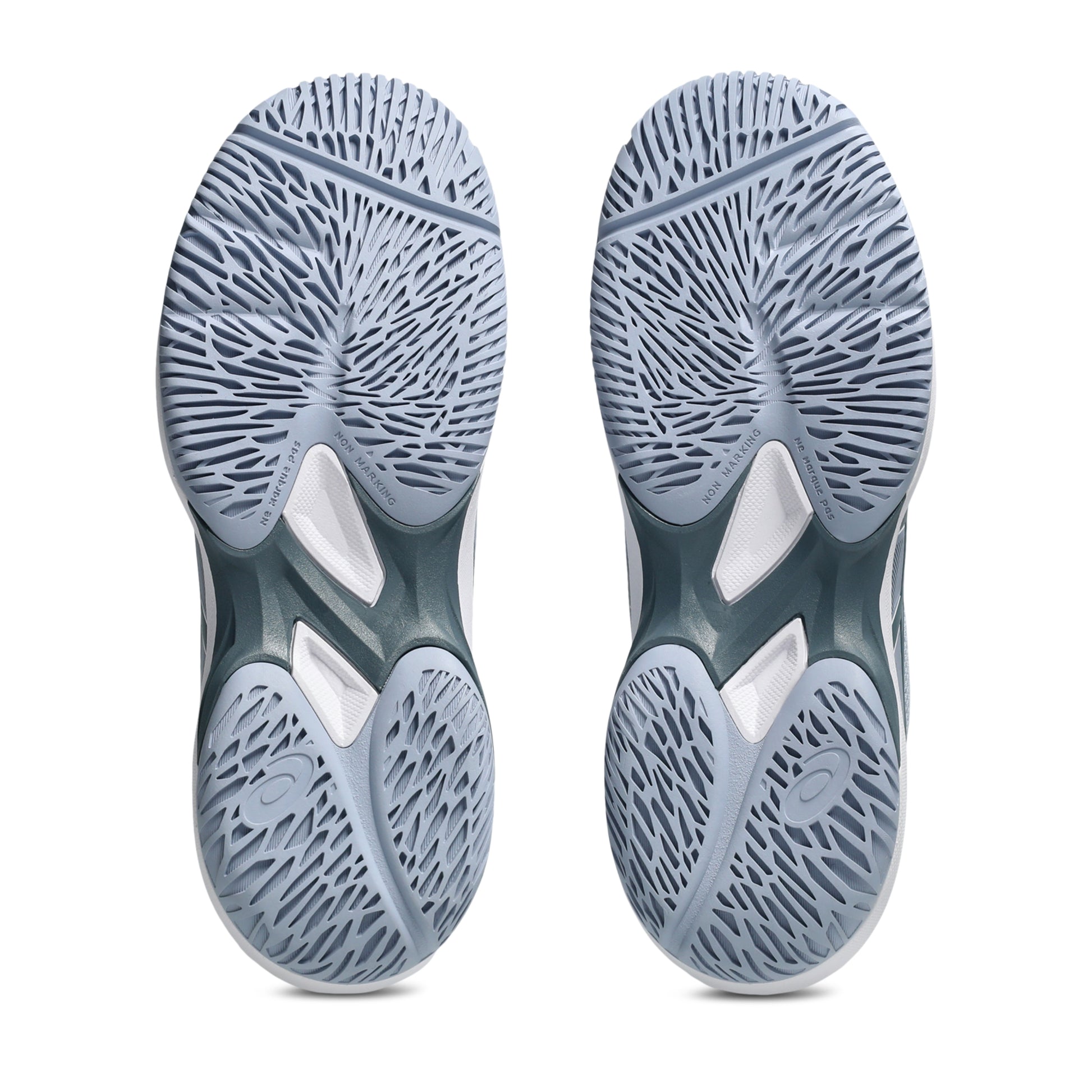 Close-up of gray tennis kids shoe soles with a textured pattern on a white background