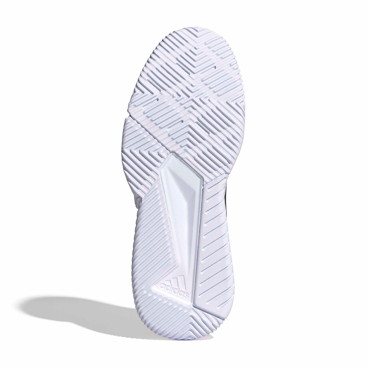 White padel shoe sole with tread pattern on a white background