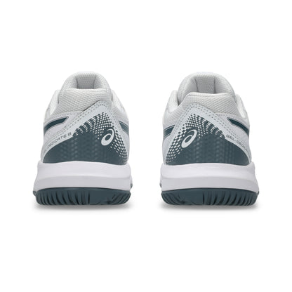 White tennis kids shoes with green accents on a white background