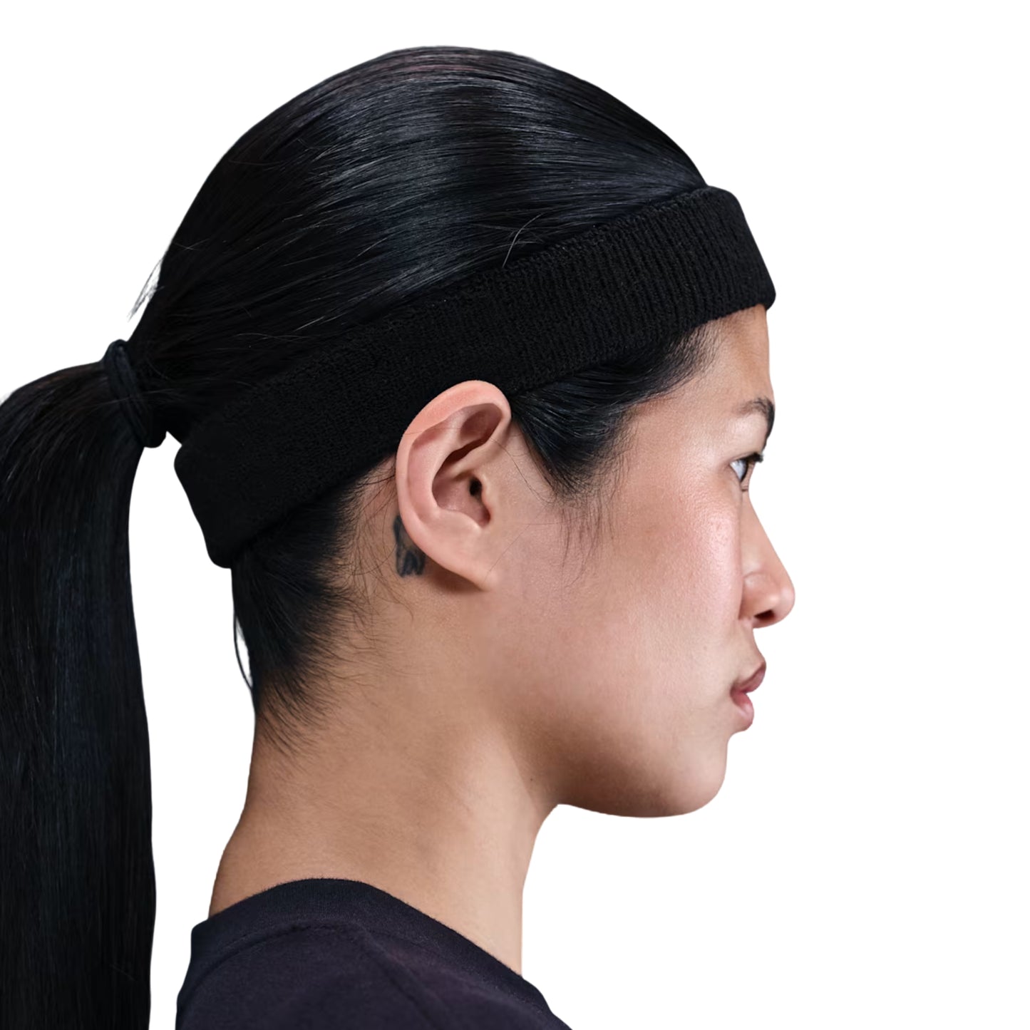 Person wearing a black headband with a white background