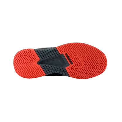 Red and black sole of a shoe on a white background